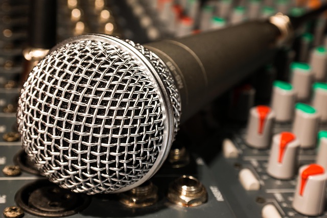 Microphone in a recording studio with warm lighting.